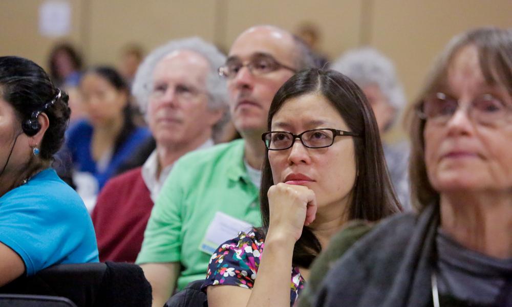 Attendees at the special forum listen to the presentation.